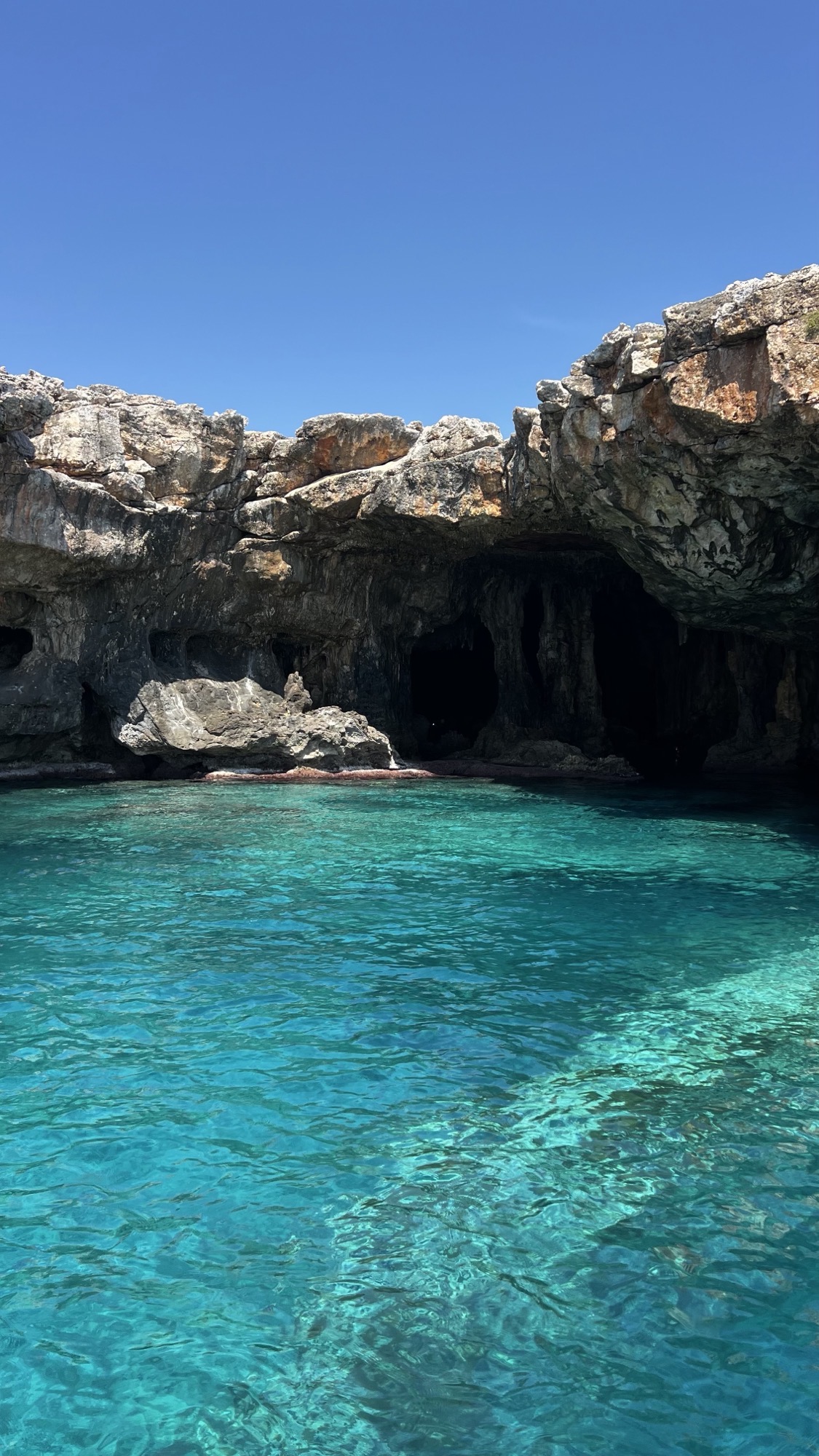 Sea cave entrance with clear turquoise water in Mallorca